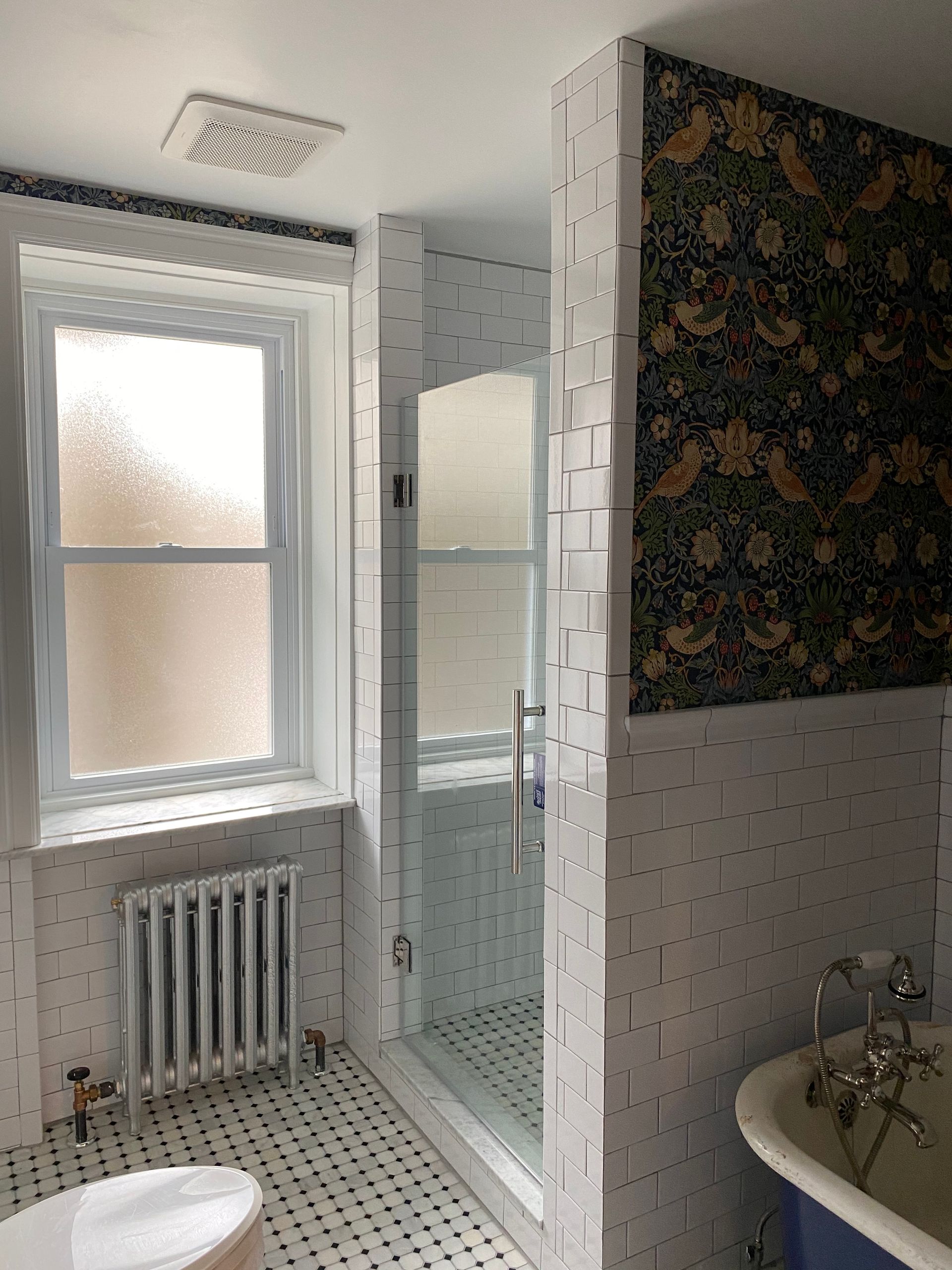 A bathroom with a tub , toilet , shower and window. James McCoy Remodeling Services Serving 19072,19003,19118,19444,19095 and surrounding areas