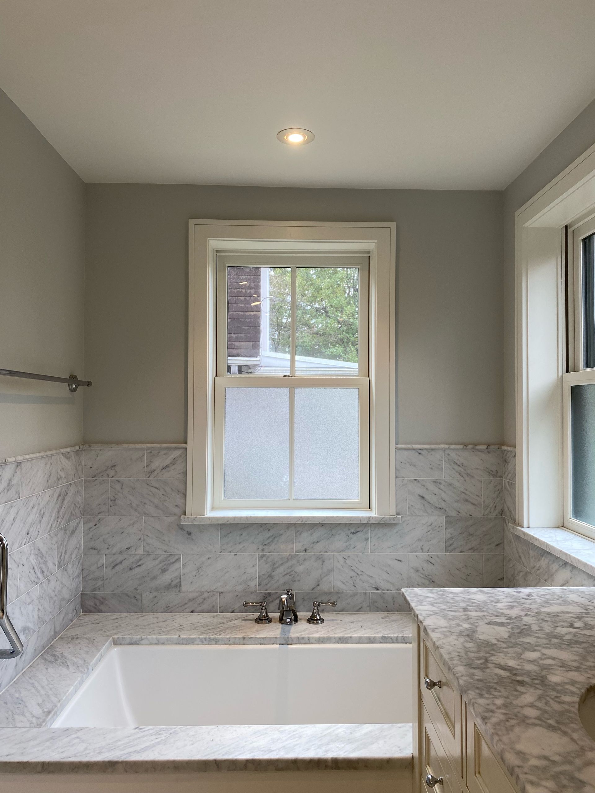 A bathroom with a tub , sink , and window. James McCoy Remodeling Services Serving 19072,19003,19118,19444,19095 and surrounding areas