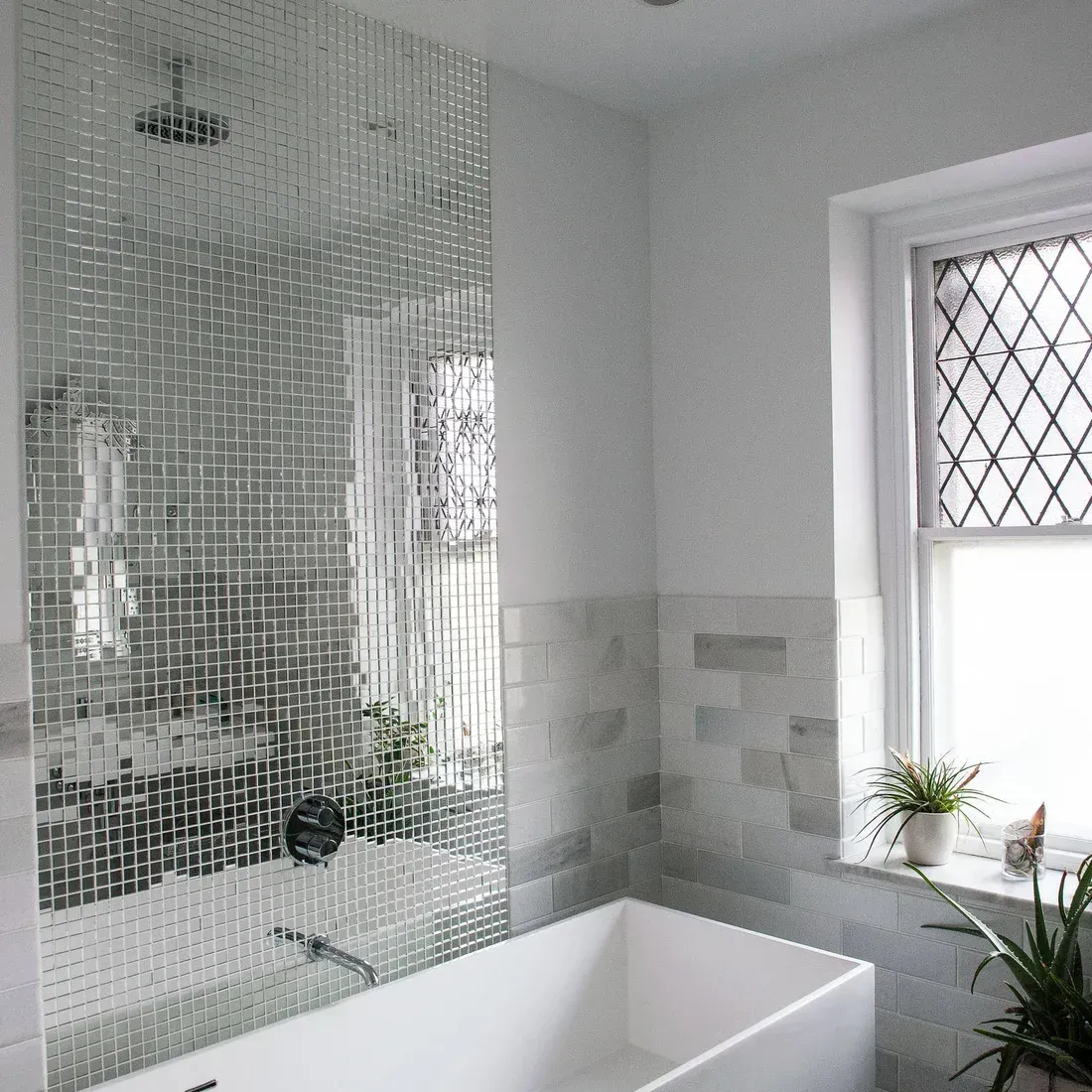 A bathroom with a bathtub and a window. James McCoy Remodeling Services Serving 19072,19003,19118,19444,19095 and surrounding areas