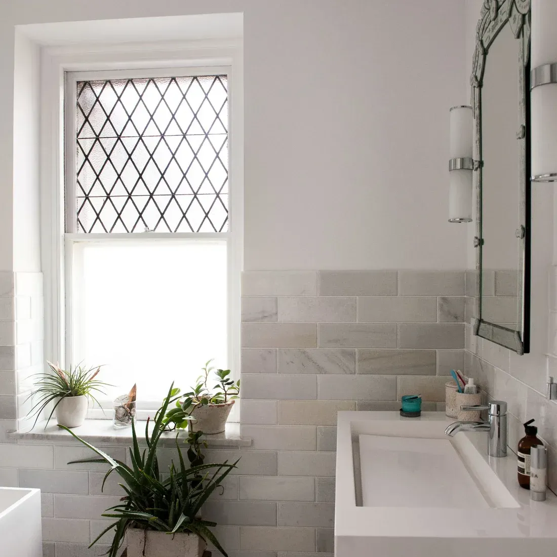 A bathroom with a sink a mirror and a window. James McCoy Remodeling Services Serving 19072,19003,19118,19444,19095 and surrounding areas