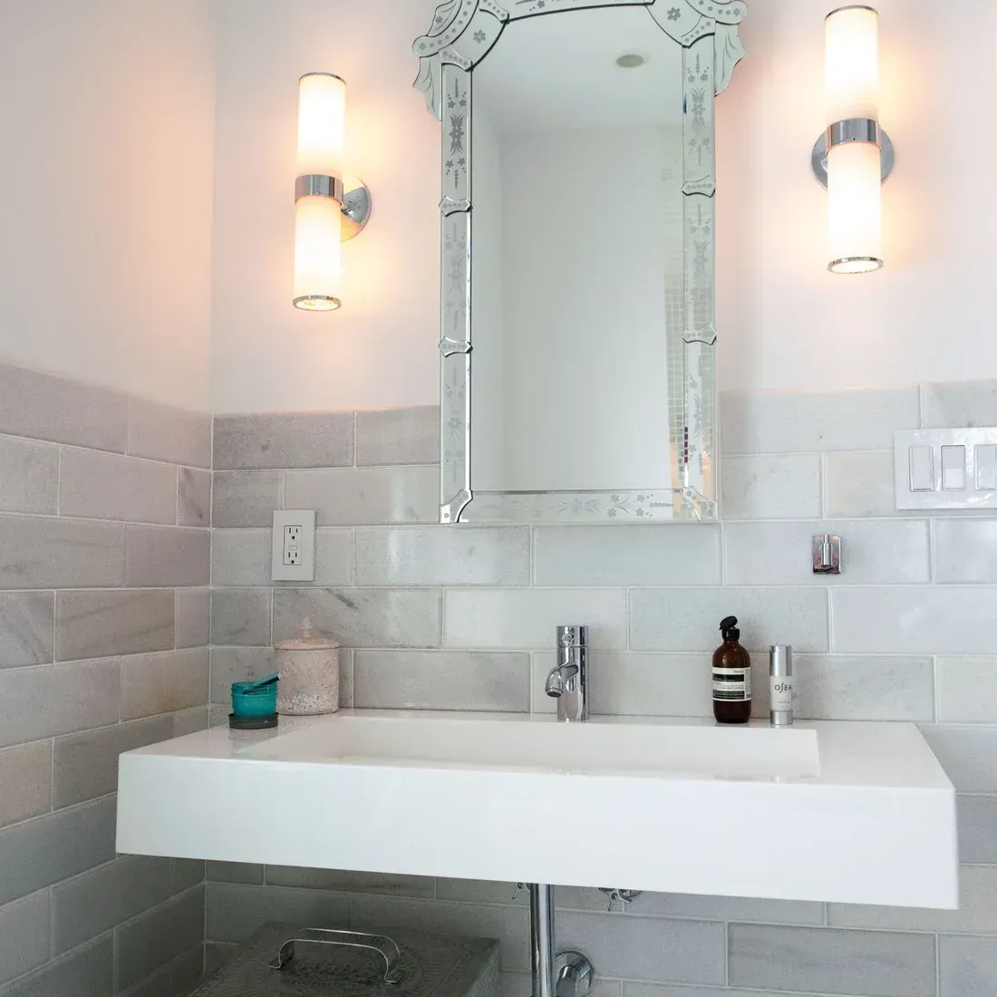 A bathroom with a sink and a mirror above it. James McCoy Remodeling Services Serving 19072,19003,19118,19444,19095 and surrounding areas