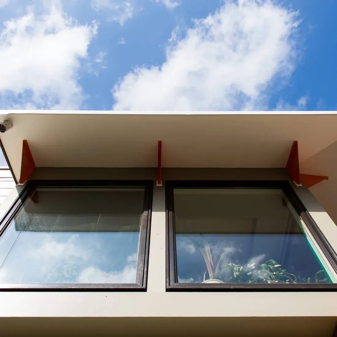 Looking up at a building with a blue sky in the background. James McCoy Remodeling Services Serving 19072,19003,19118,19444,19095 and surrounding areas