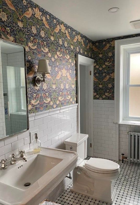 A bathroom with a sink , toilet and mirror. James McCoy Remodeling Services Serving 19072,19003,19118,19444,19095 and surrounding areas