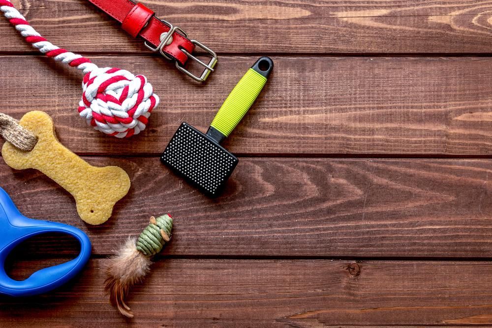A Wooden Table Topped With A Variety Of Dog Supplies — Barking Happy Treats In Collombatti, NSW