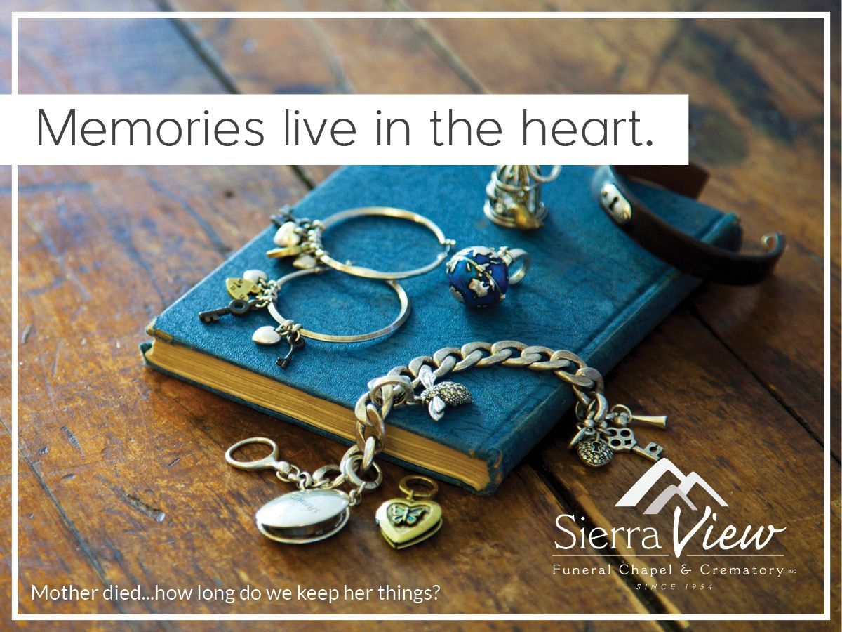 A photo of jewelry on top of a small notebook with the caption 