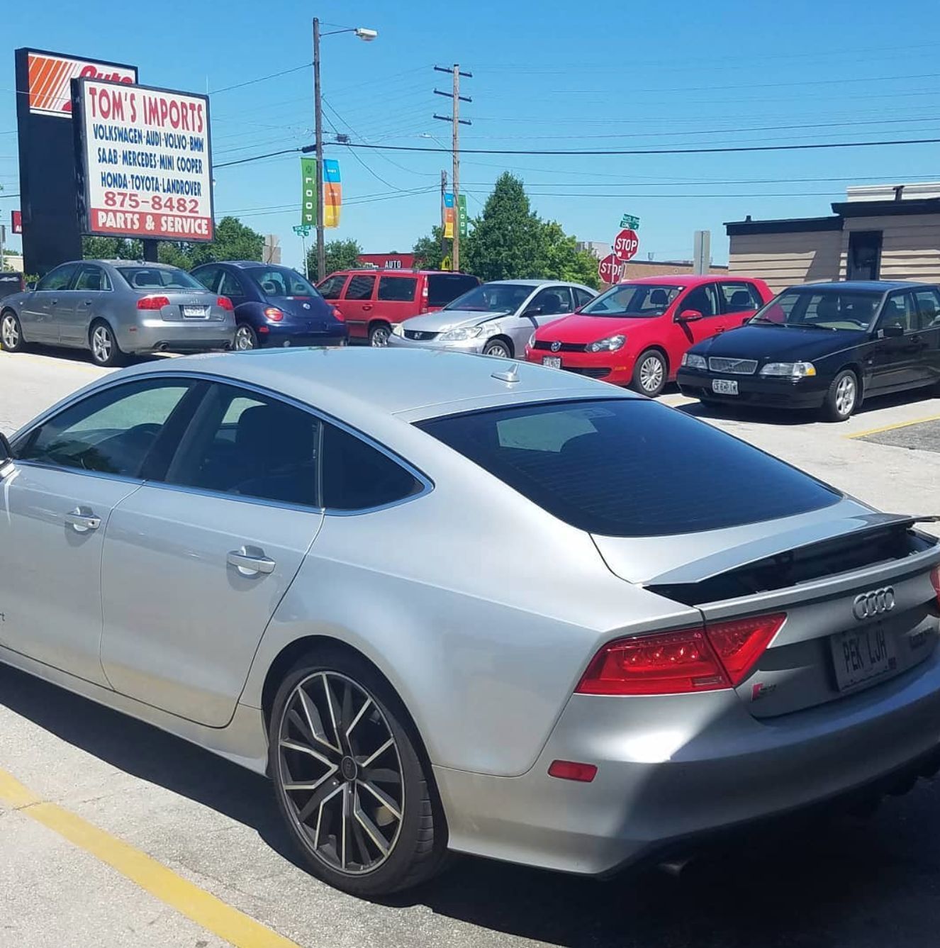 Silver Audi Parked in Front of Shop | Tom’s Auto & Imports