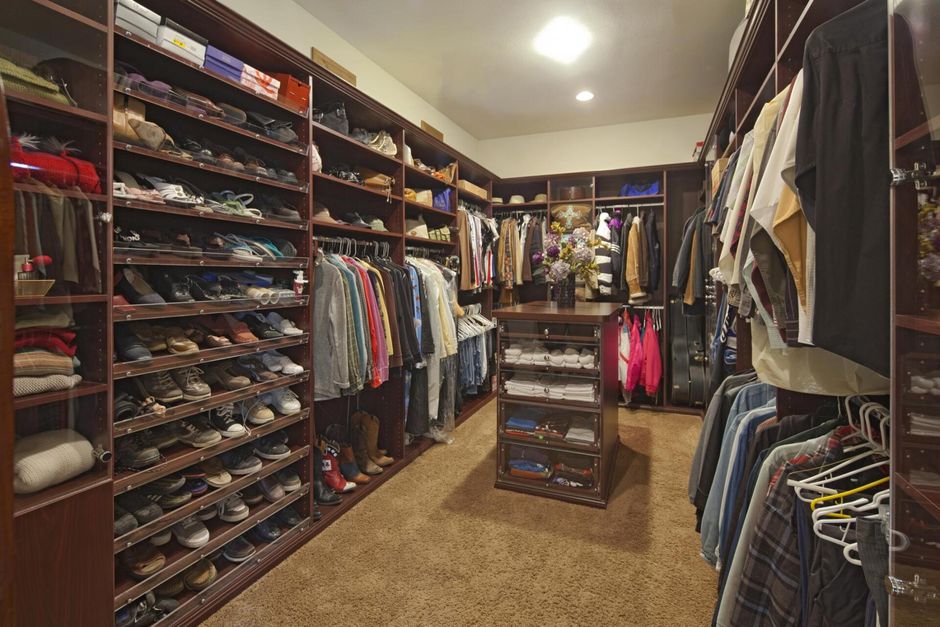 a closet with full of clothes
