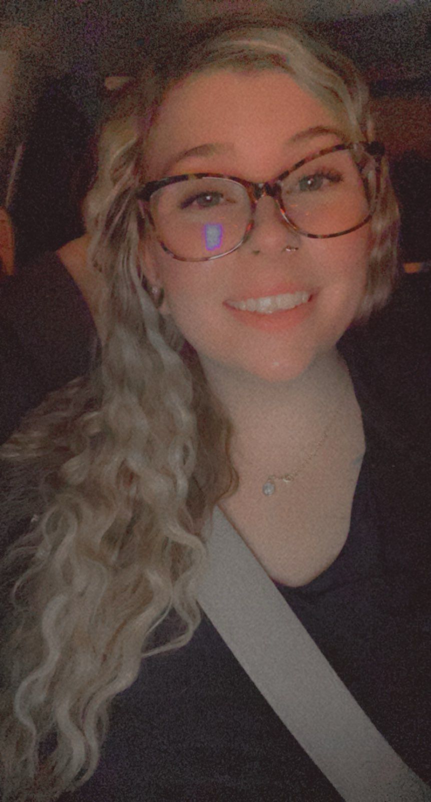 A man in a blue shirt with a name tag on his chest