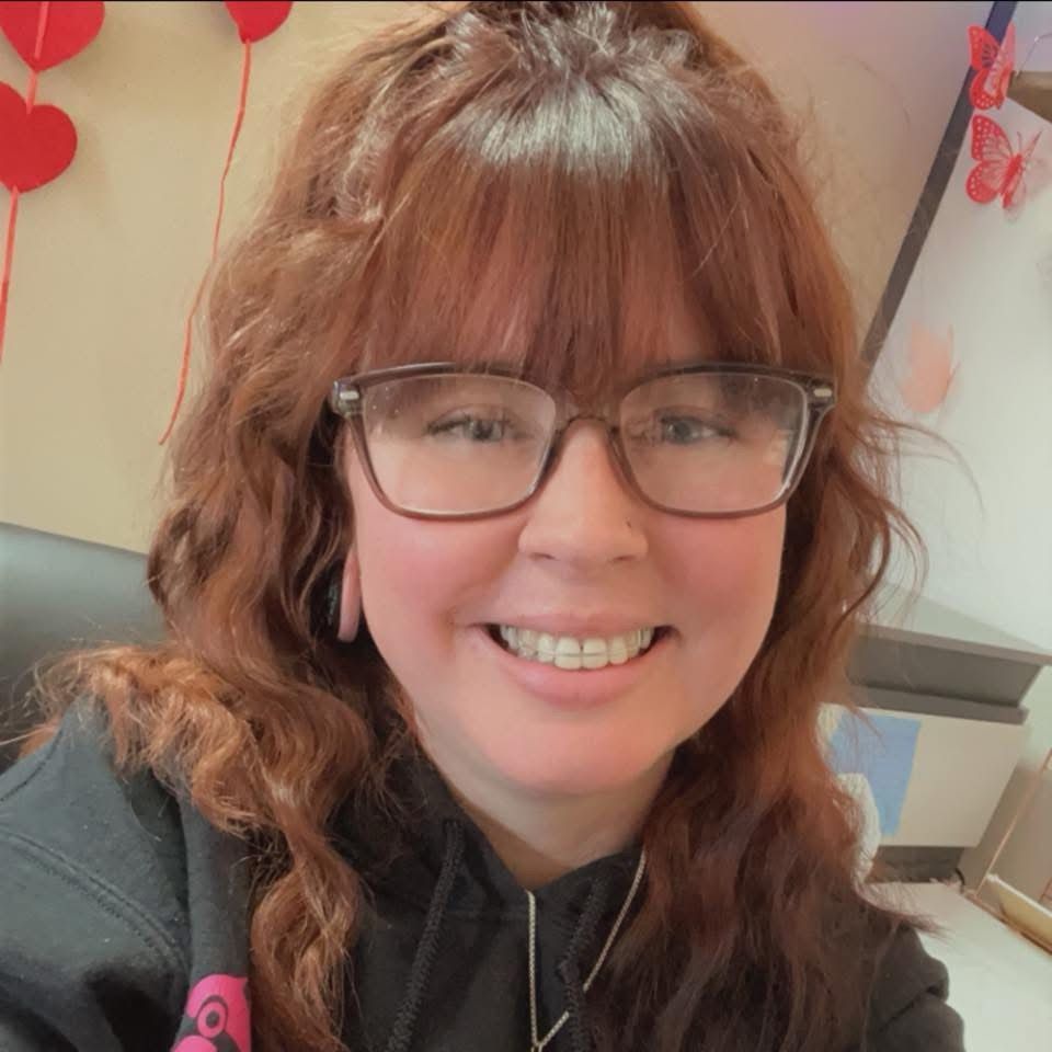 A man holding a cardboard box that says fragile on it