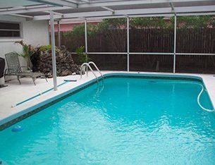 Benefits Of Pool Enclosures ─ Swimming Pool Enclosed By Screens in Pensacola, FL