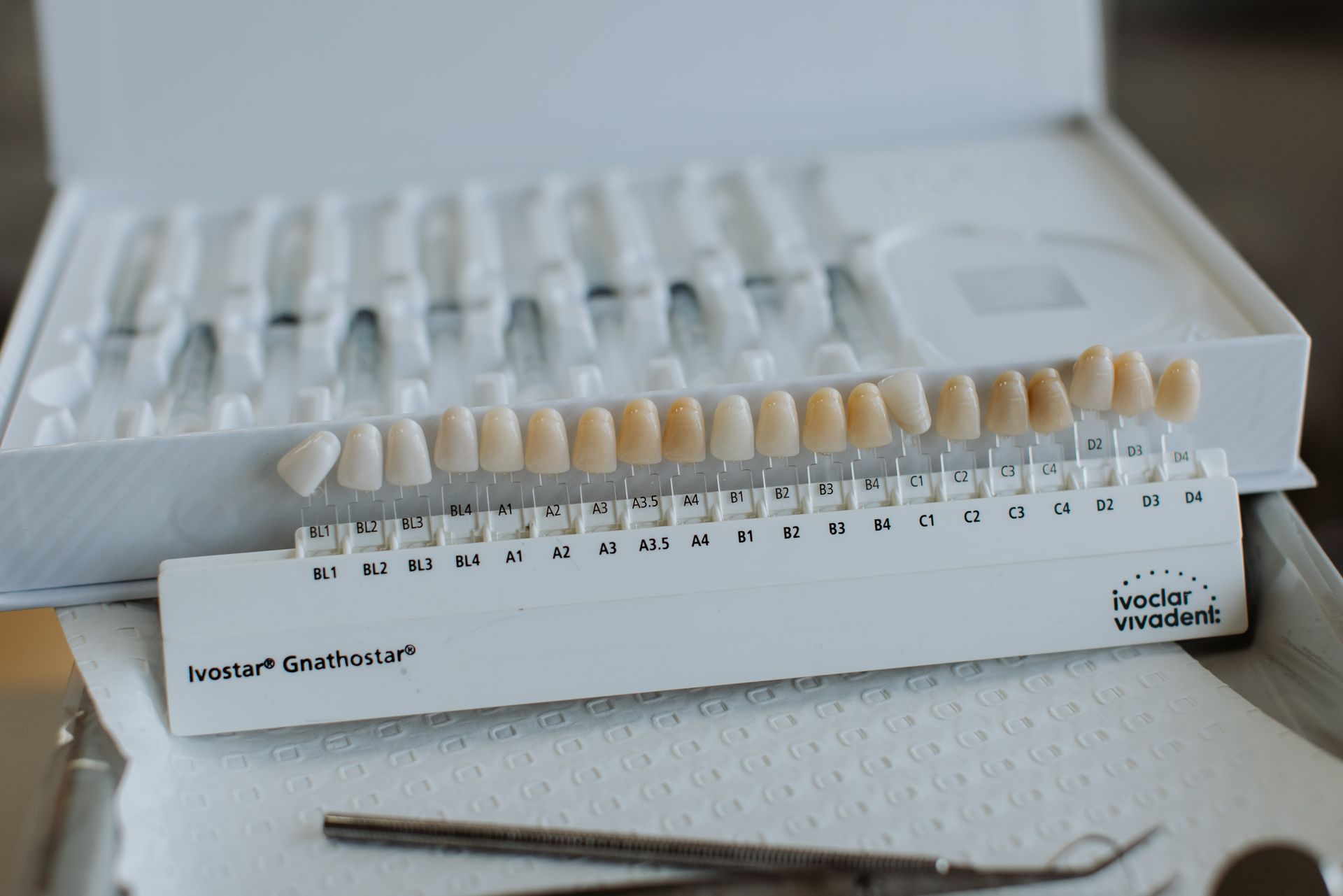 A box of dental samples is sitting on a table.