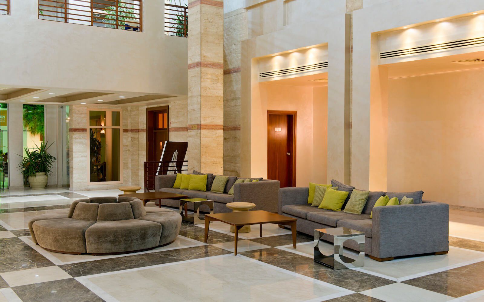 Elegant hotel lobby with modern seating and welcoming ambiance. 