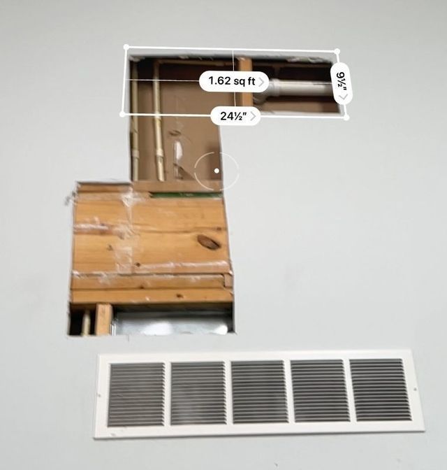 a picture of a hole in a wall with measurements on it
