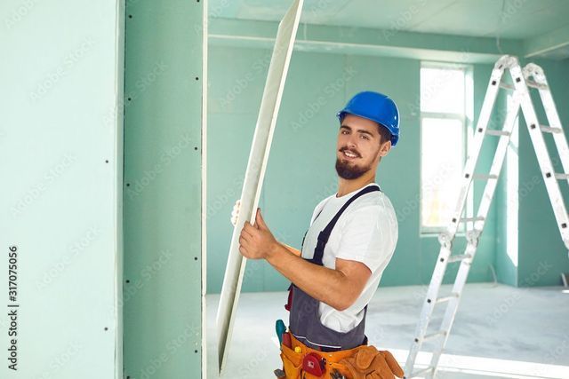 man with drywall