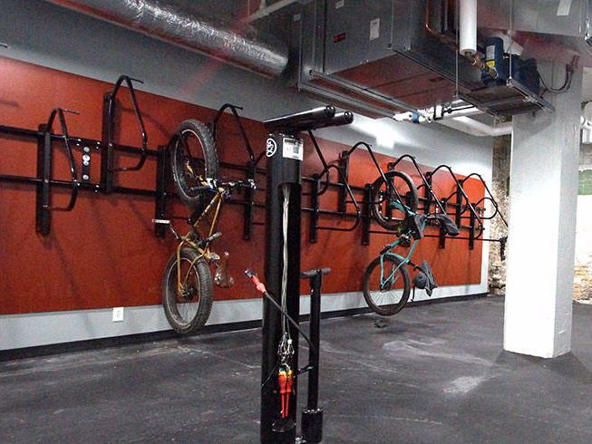 Bike storage area with bike racks and a repair stand.