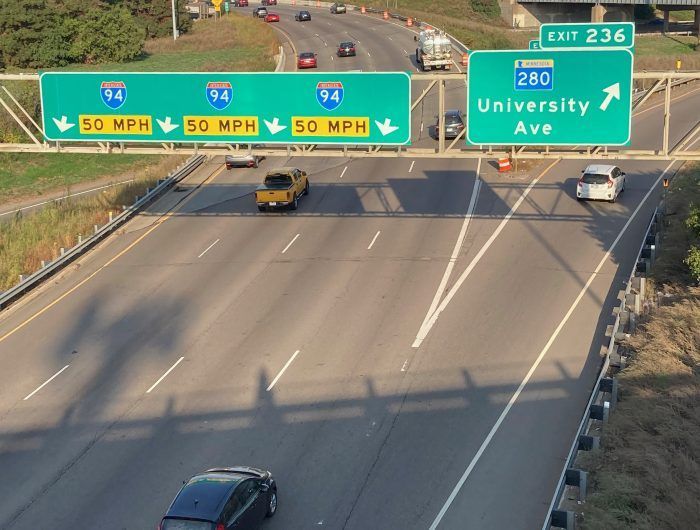 Overhead view of highway with green signs indicating I-94 and MN 280.