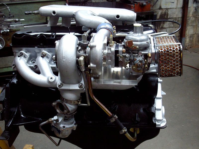 A close up of a car engine with a turbo