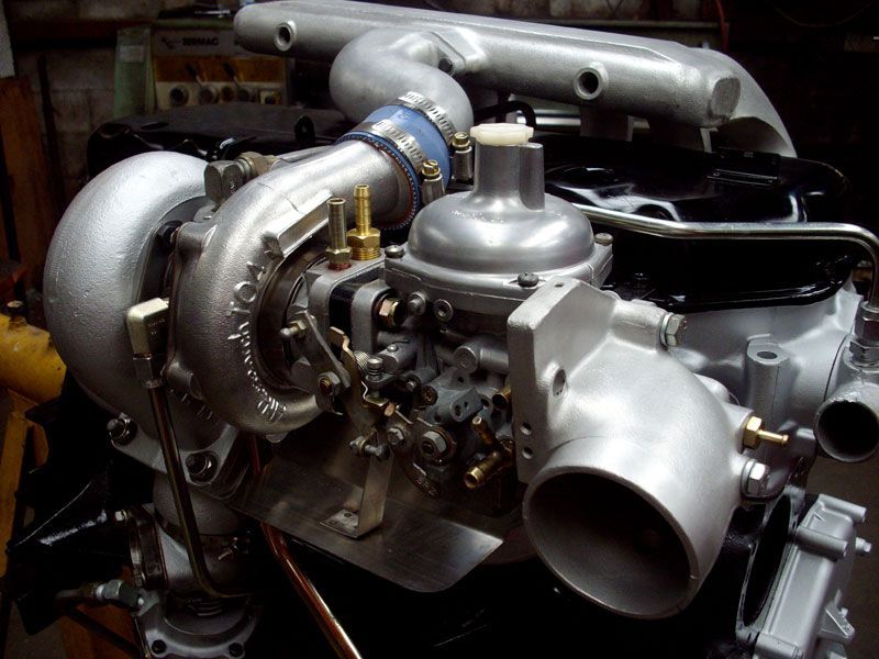 A close up of a car engine with a turbo