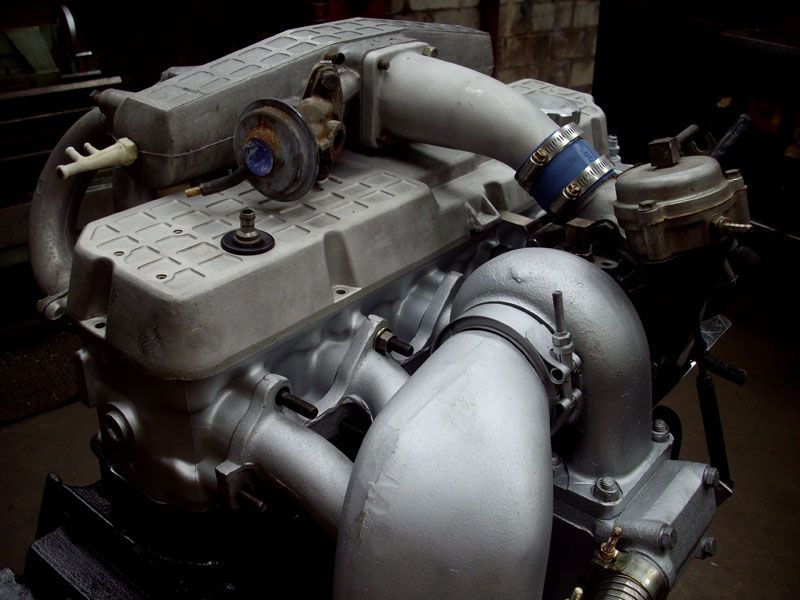 A close up of a car engine with a turbo