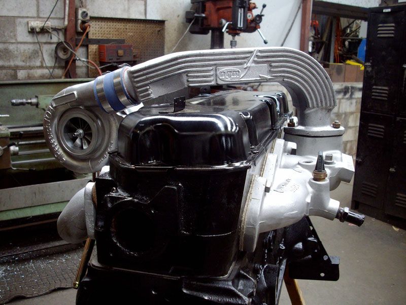 A black engine with a turbo attached to it
