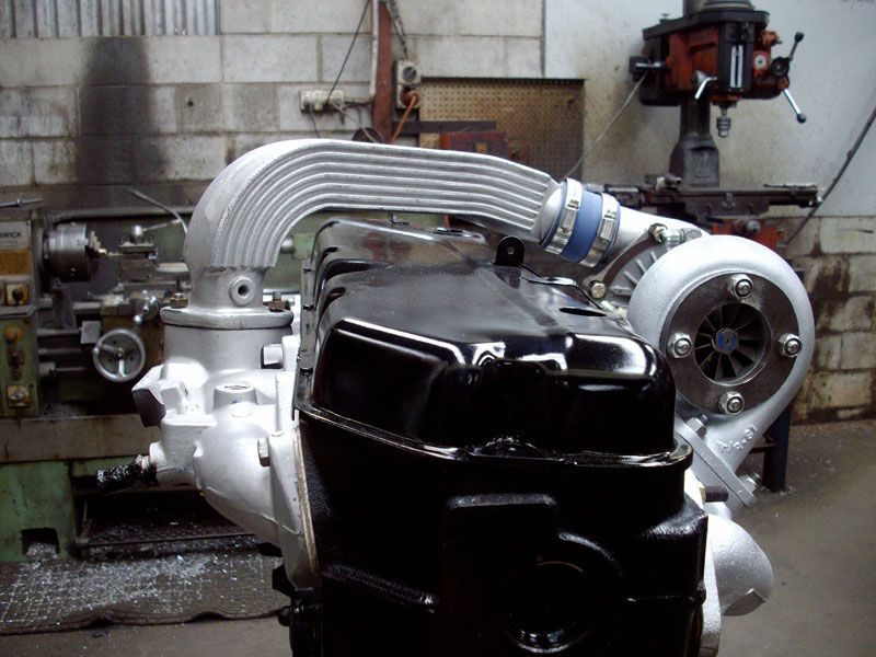 A black engine with a turbo attached to it