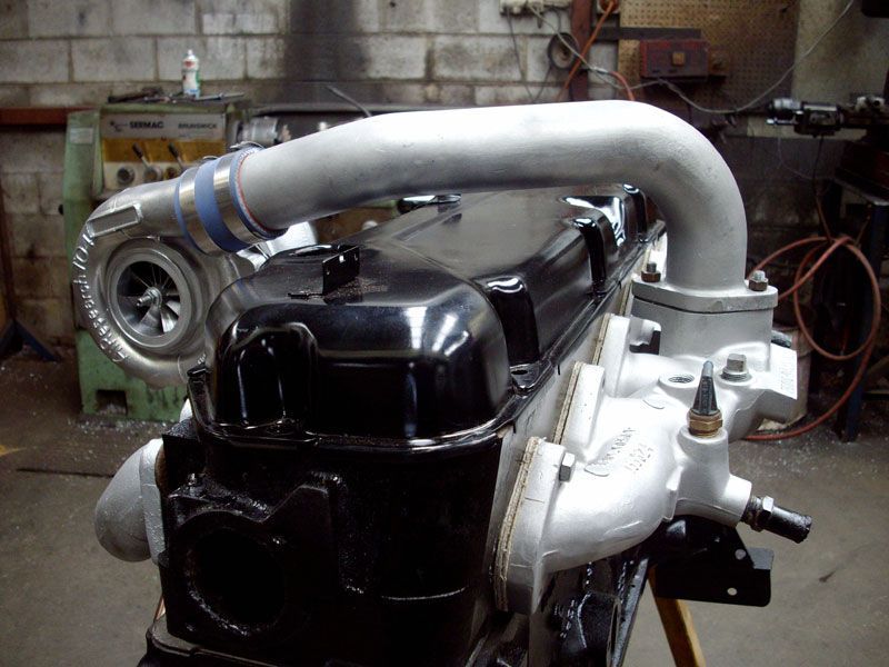 A black engine with a turbo attached to it