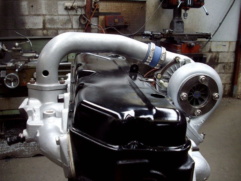 A turbocharger is attached to a black engine