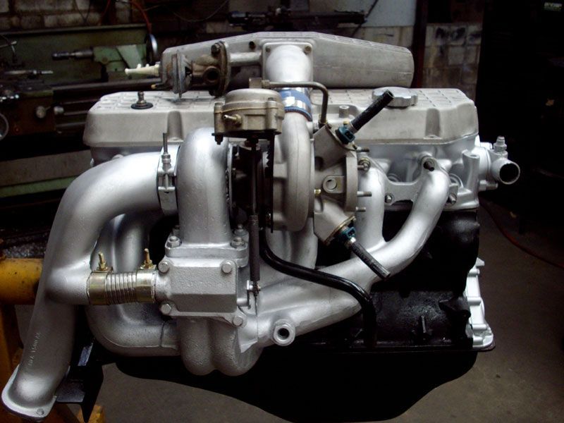 A close up of a car engine with a turbo