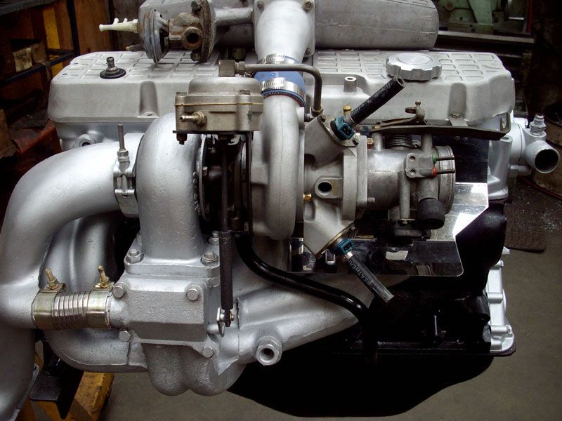 A close up of a car engine with a turbo
