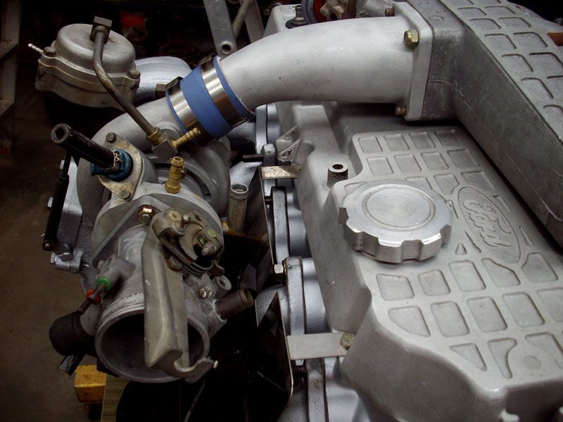 A close up of a ford engine with a turbo