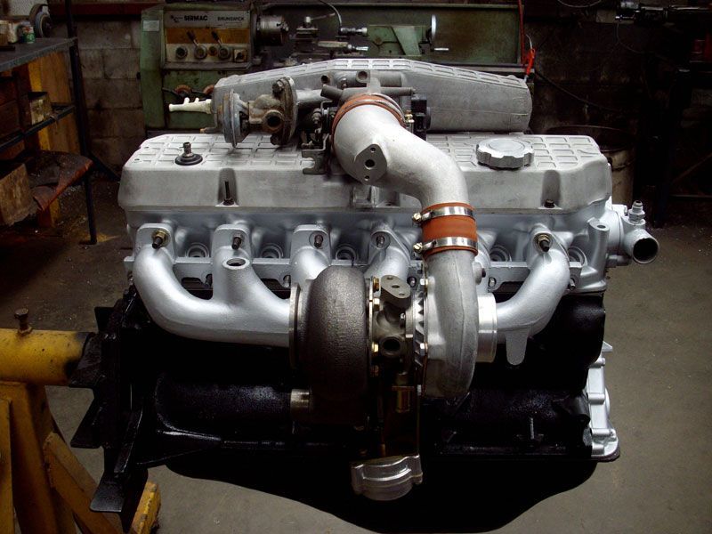 A car engine with a turbo attached to it