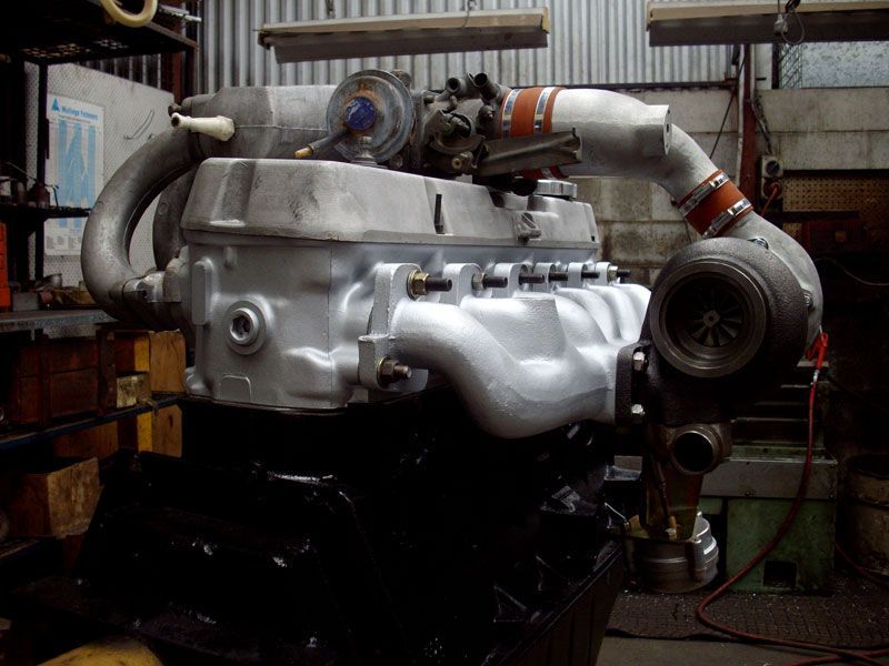 A large engine with a turbocharger attached to it
