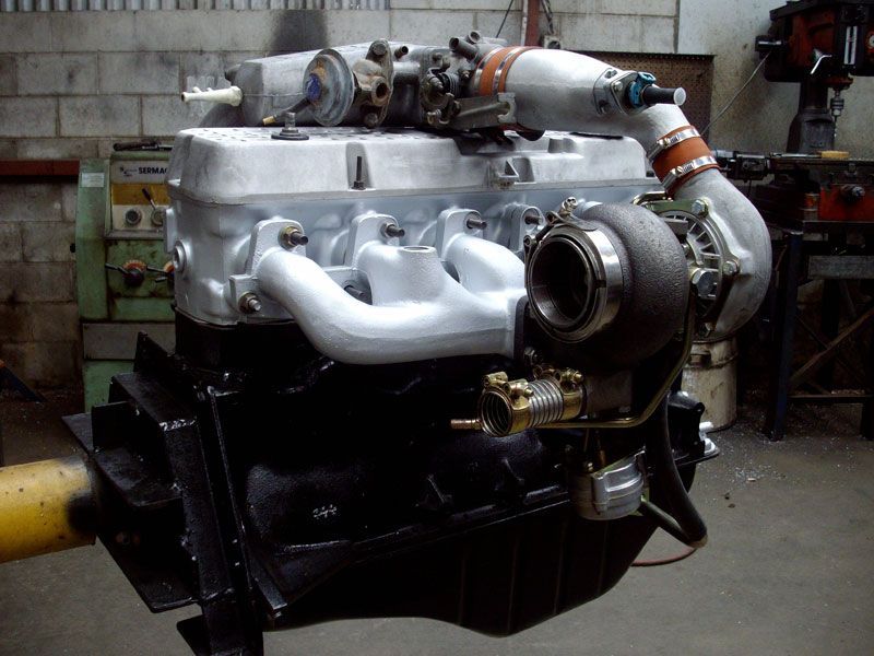 A car engine with a turbo attached to it