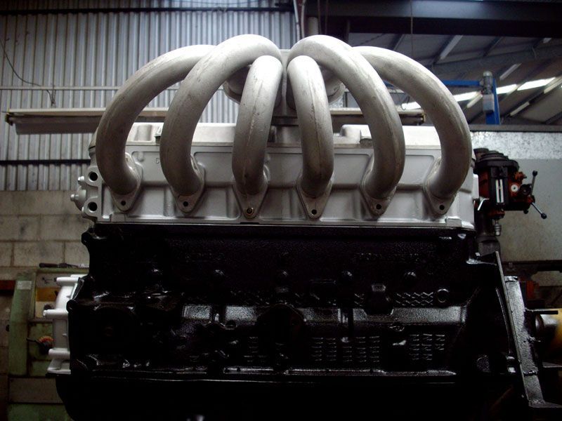 A large engine with a lot of pipes on it