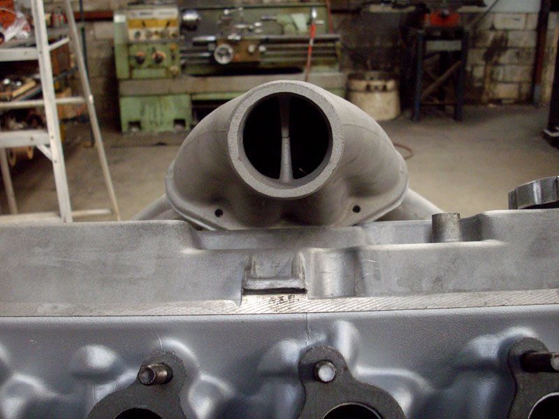 A close up of a metal object with a hole in the middle