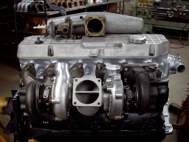 A car engine with a turbo on top of it