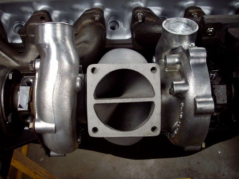 A close up of a turbocharger on a car engine
