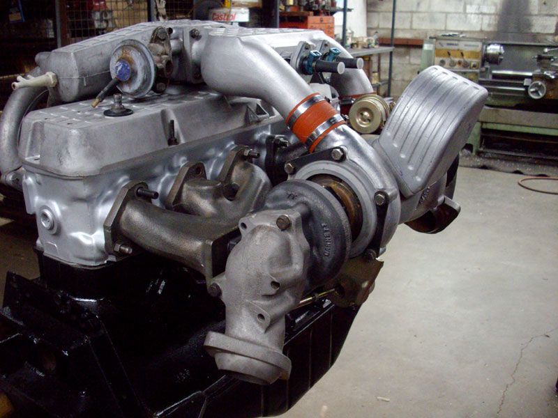 A large engine with a turbo attached to it