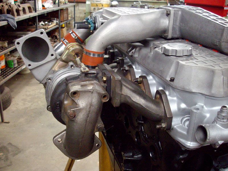 A close up of a turbocharger on a car engine