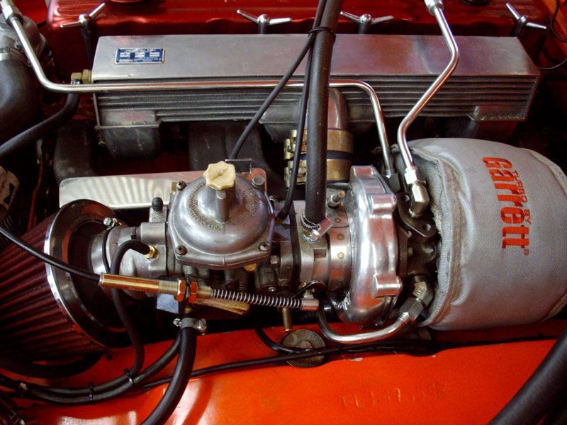 A close up of a garrett turbocharger in a car