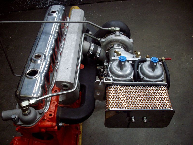 A close up of a car engine with a turbo