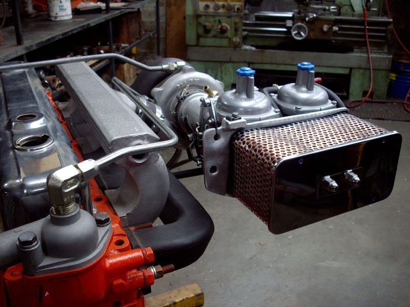 A car engine with a turbocharger attached to it