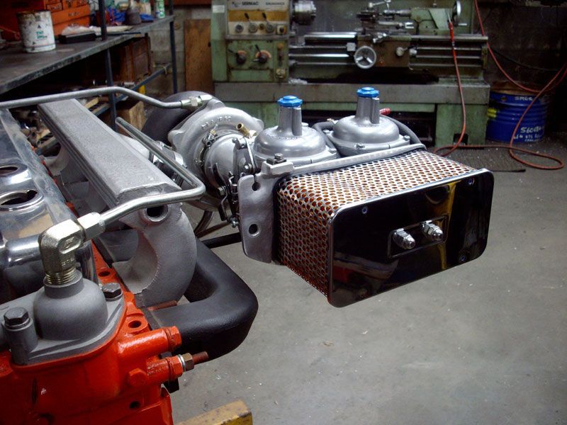 A car engine is being worked on in a garage