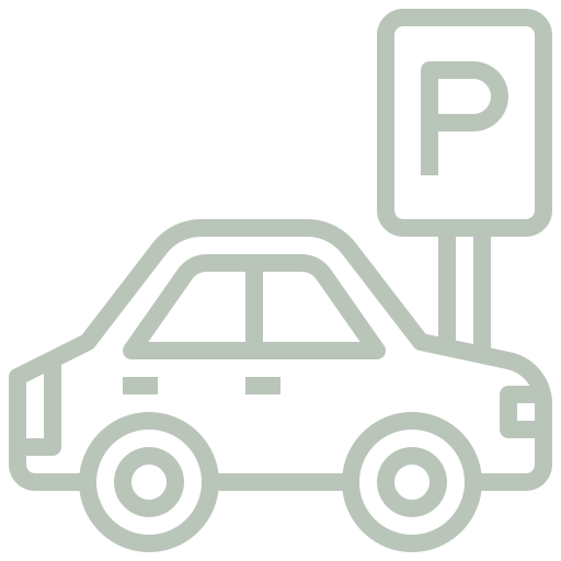 A car is parked next to a parking sign.