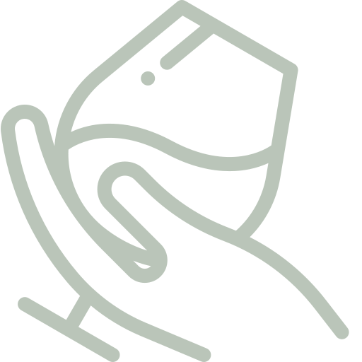 A line drawing of a hand holding a glass of wine.