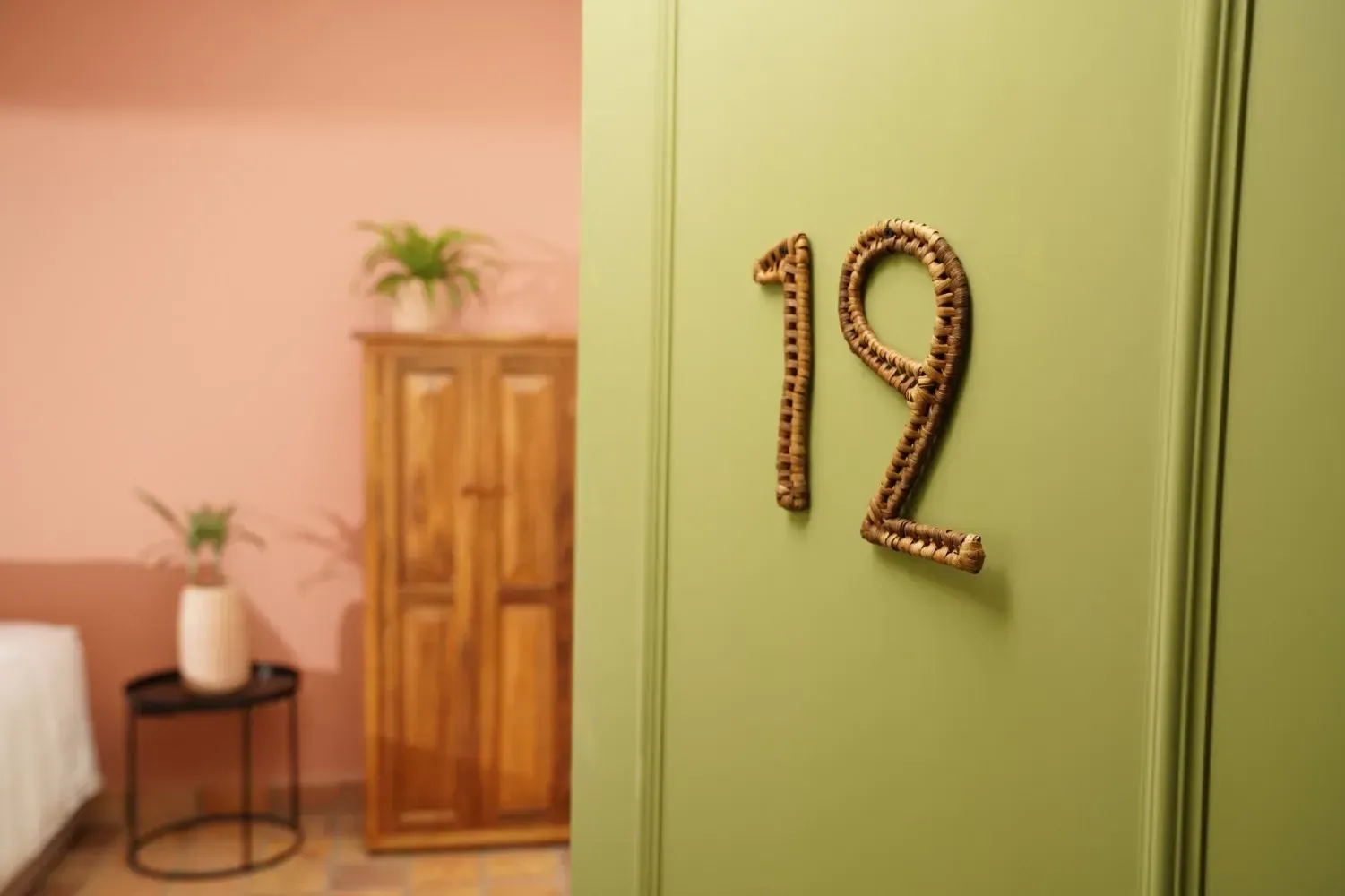 A green door with the number 12 on it