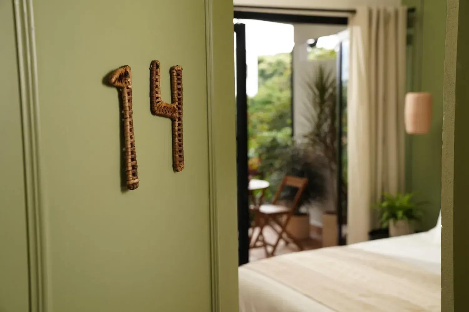 A bedroom with the number 14 on the wall