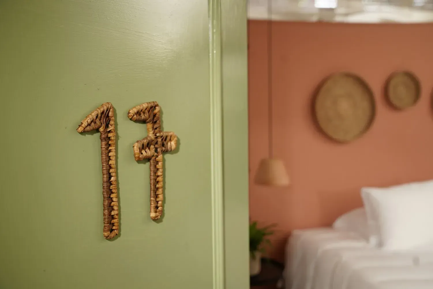 The number 17 is on the door of a hotel room.