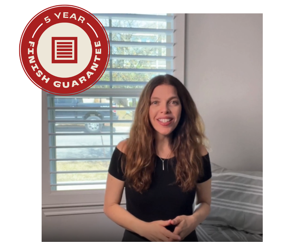 A woman stands in front of a window with a 5 year finish guarantee sticker