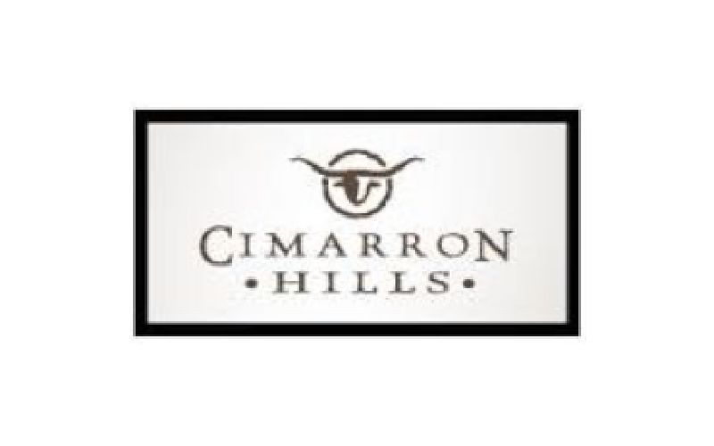 The logo for cimarron hills has a picture of a bull on it.